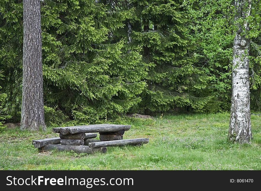 A table near a road where you can stop and eat. A common sight in Sweden. A table near a road where you can stop and eat. A common sight in Sweden.