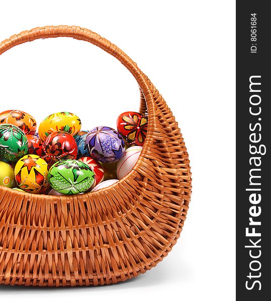 Couple of colorful Easter Eggs in a yellow basket. Couple of colorful Easter Eggs in a yellow basket.