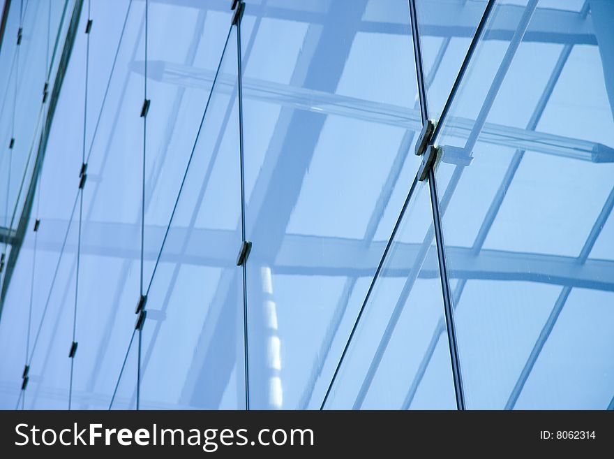 Low angle shot of a glass building in London. Low angle shot of a glass building in London