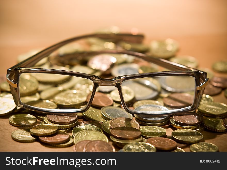 Reading glasses over money - shallow depth of field