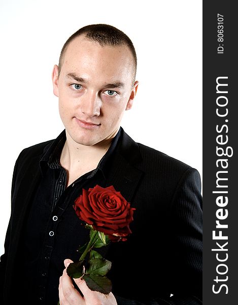 Man holding a rose on a with background. Man holding a rose on a with background