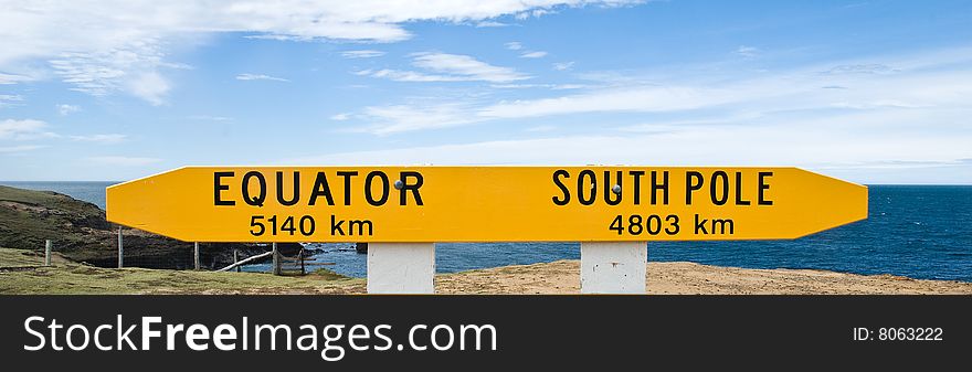 Signpost pointing to both the South Pole and the Equator. New Zealand -southern tip of the South Island. Signpost pointing to both the South Pole and the Equator. New Zealand -southern tip of the South Island