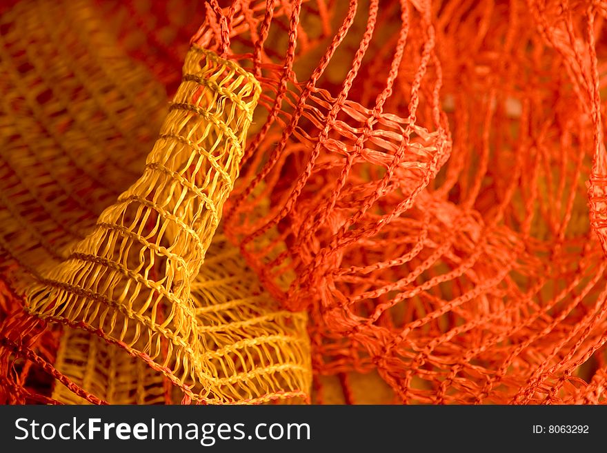 Close up with shallow depth of field of a thick net used to enclose building sites