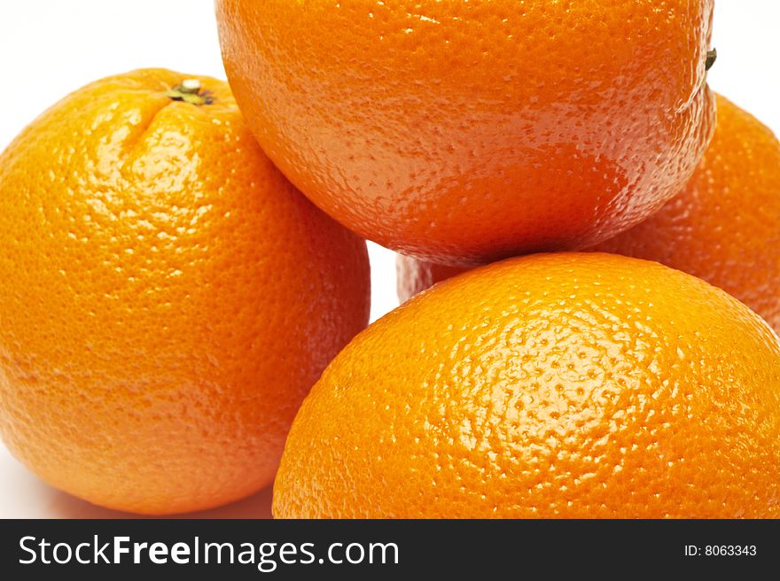 Closeup of Fresh Oranges on white background