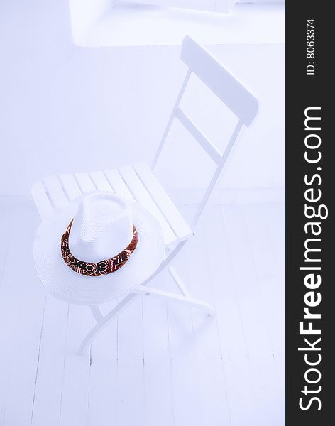 Headgear and chair photograph in the white room