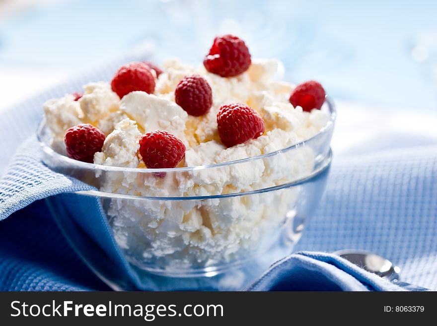 Glass bowl with soft cheese and raspberry. Glass bowl with soft cheese and raspberry