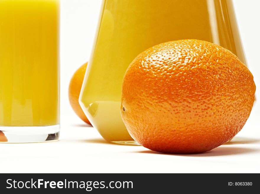 Fresh orange and juice on white background