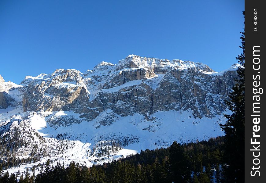 Beautiful mountains covered by snow and trees. Beautiful mountains covered by snow and trees