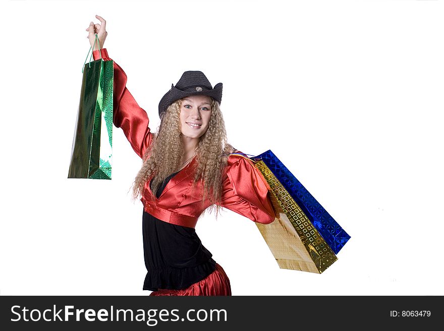 The young beautiful girl with purchases in colour packages during shopping on a white background