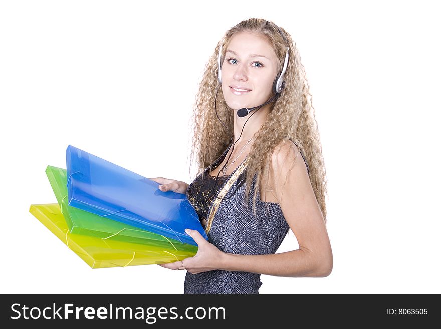 The young beautiful businesswoman at office behind work on a white background. The young beautiful businesswoman at office behind work on a white background