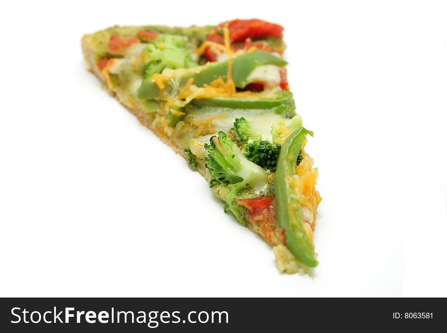 An isolated slice of a vegetarian pesto pizza.