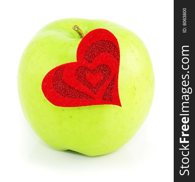 Green apple and red heart made of cloth isolated on a white background