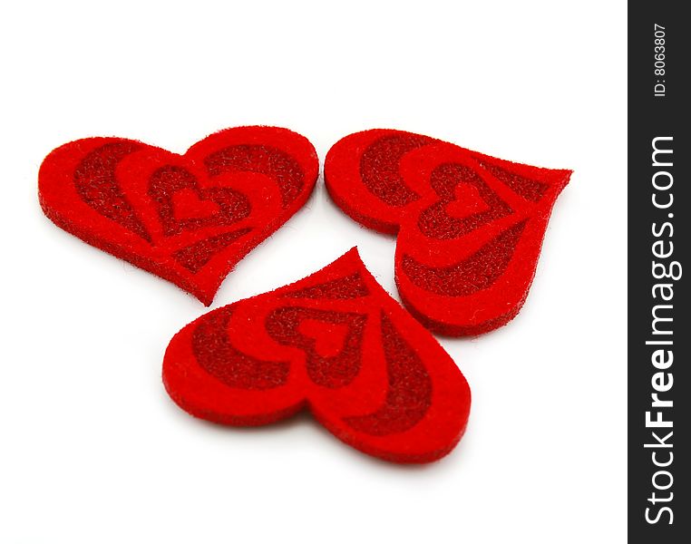 Three hearts made of cloth isolated on a white background