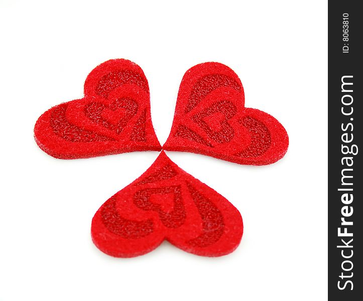 Three hearts made of cloth isolated on a white background