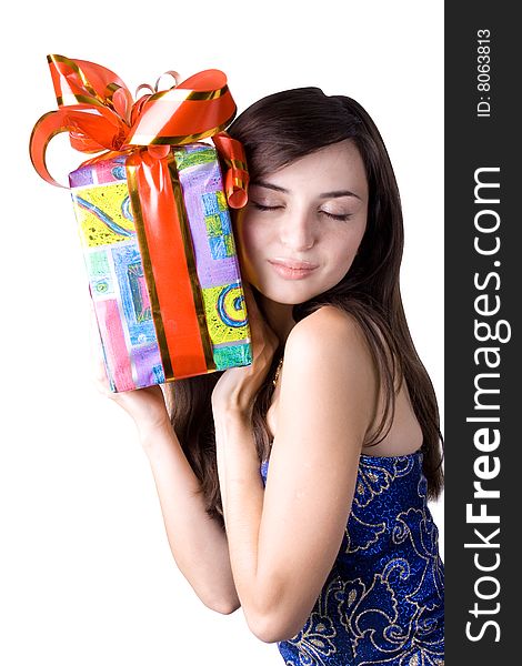 The young beautiful girl with a gift box on a white background