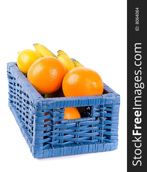 Blue basket with fruits on white background