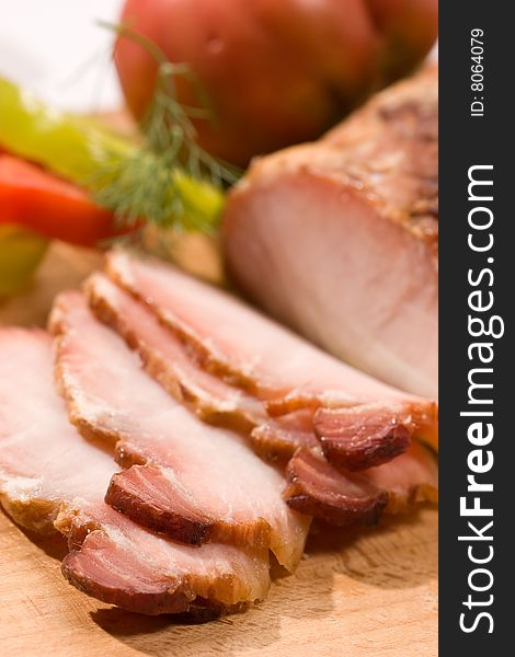 Food series: sliced ham on the wooden board
