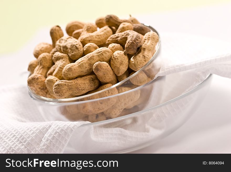 Foodstuff theme:  peanut on the glassy bowl