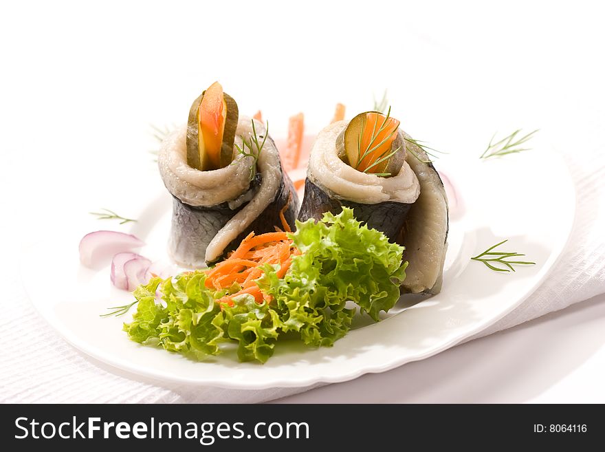 Food series: fillet herring with vegetables over white. Food series: fillet herring with vegetables over white