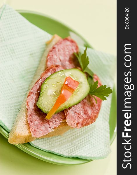 Food series: fresh sandwich with salami, cucumber