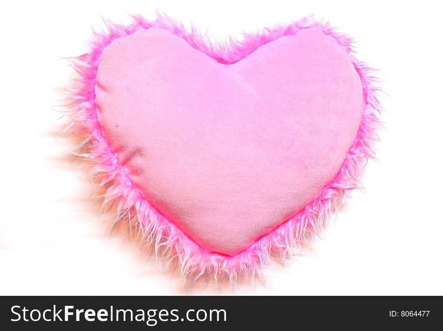 Pink heart a cushion is isolated on white