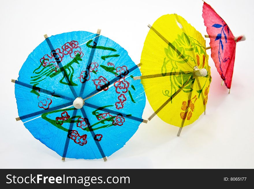 color paper umbrellas on white