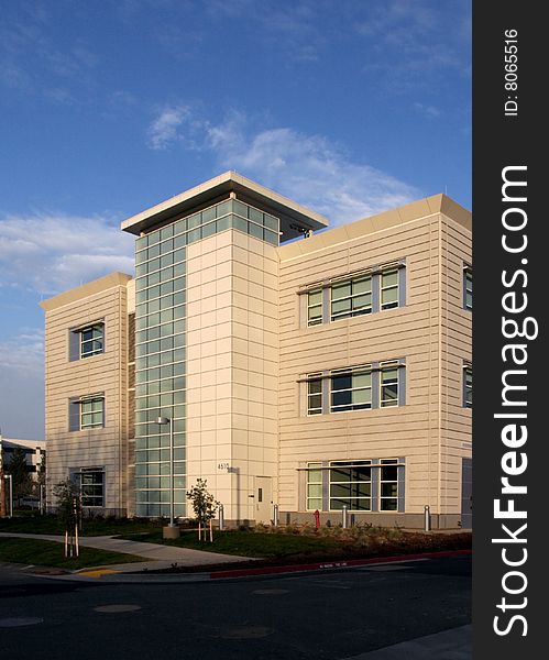 An office building with a empty parking lot