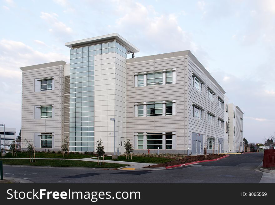 An office building with a empty parking lot