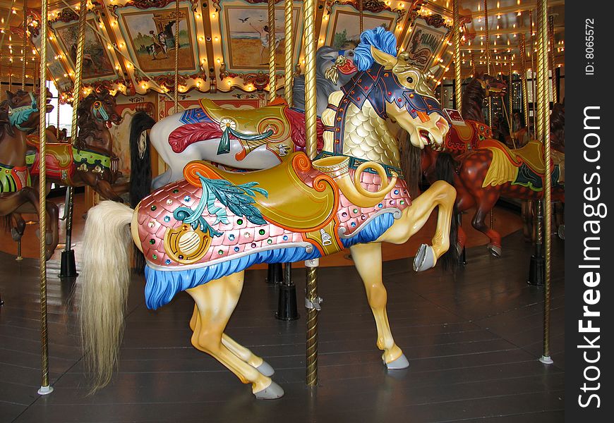 An old, restored merry-go-round of different animals. An old, restored merry-go-round of different animals