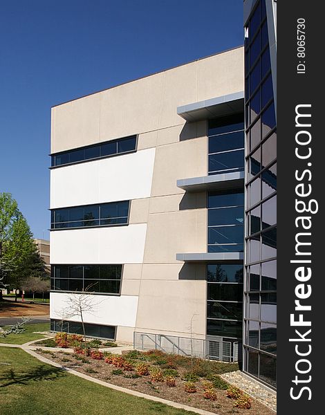 An office building with a empty parking lot