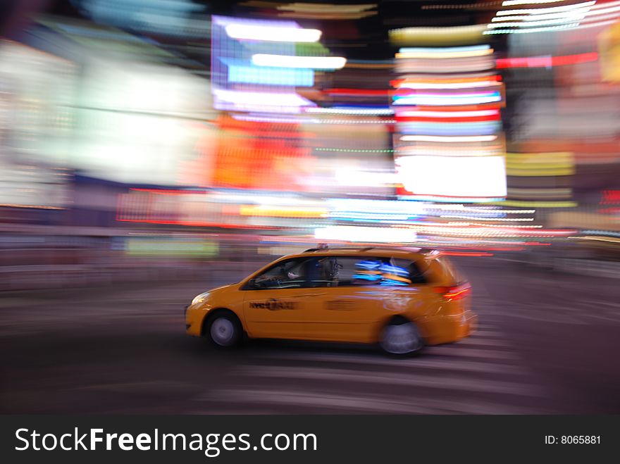 New York Yellow Taxi Speeding Through Times Square