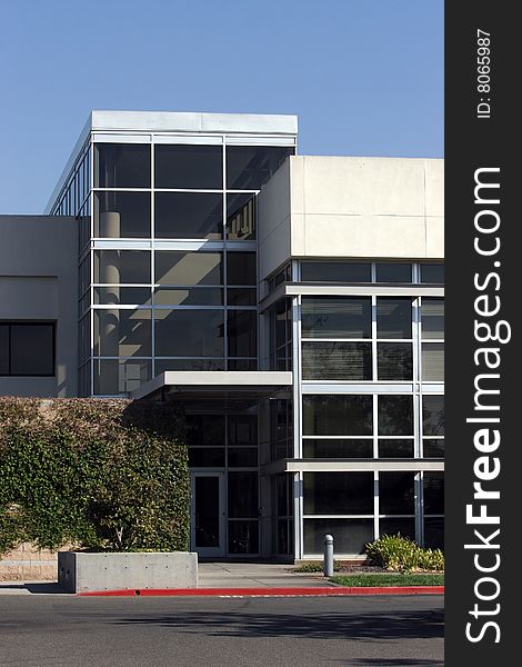 An office building with a empty parking lot