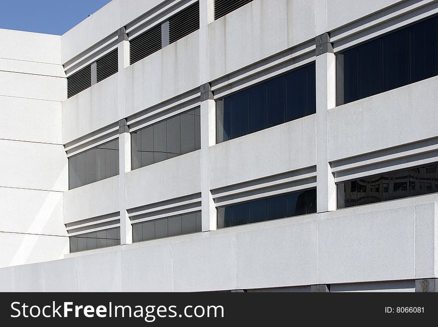 An office building with a empty parking lot