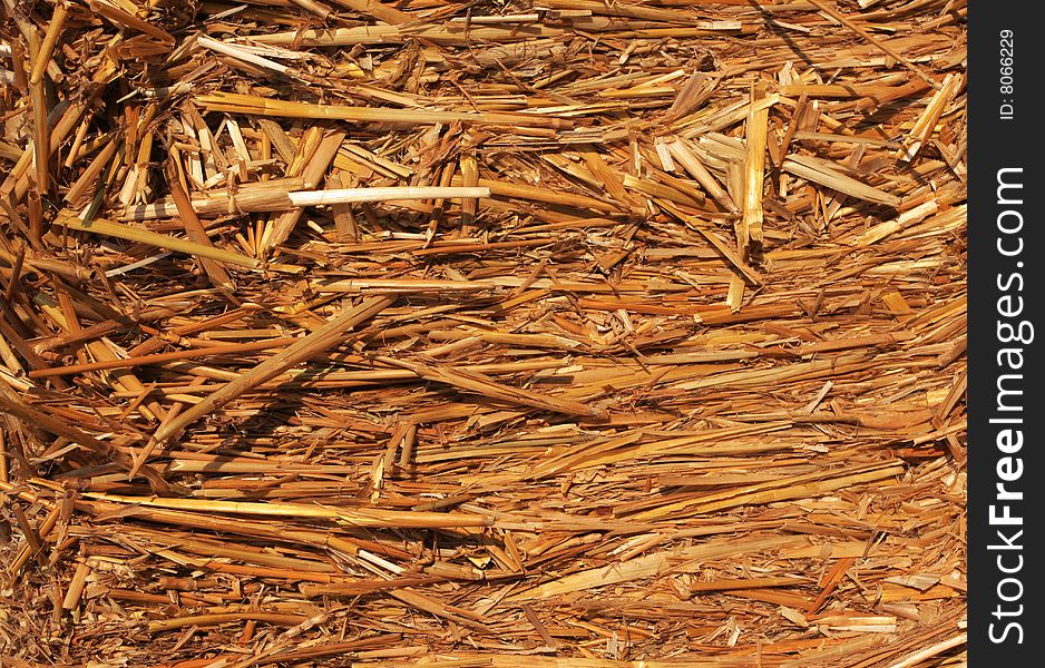 Straw hay bail, lit with wam afternoon sun great for backgrounds or any agricultural designs. Straw hay bail, lit with wam afternoon sun great for backgrounds or any agricultural designs