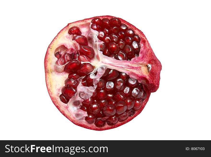 Half of pomegranate isolated on a white background. Half of pomegranate isolated on a white background.