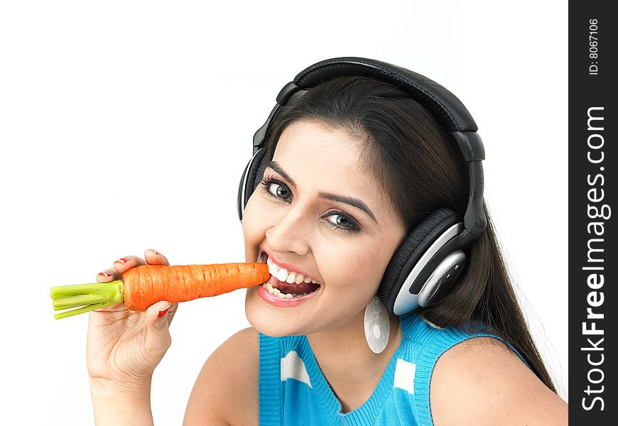 Beautiful Woman Eating A Carrot