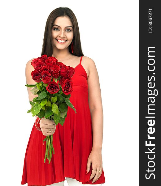A smiling woman with a bouquet of red roses. A smiling woman with a bouquet of red roses