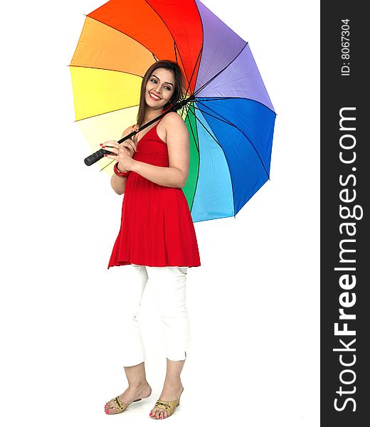 Woman standing with rainbow umbrella