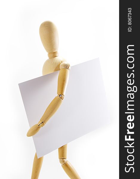 Wooden mannequin holding blank note under arm on white background