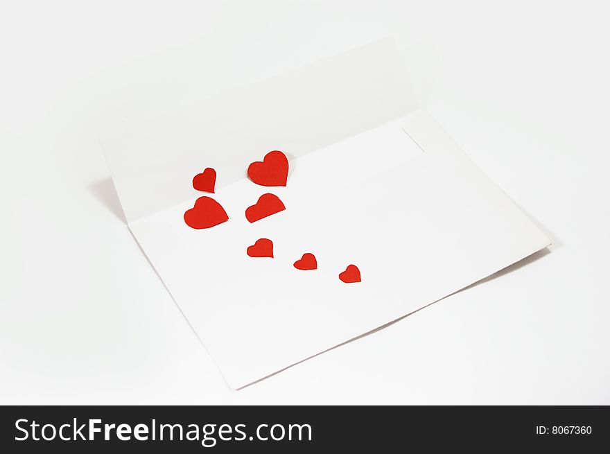 White envelope with hearts over white. White envelope with hearts over white