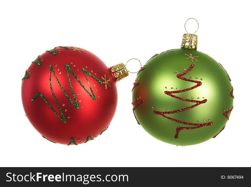 Red and green christmas ornaments isolated on white. Red and green christmas ornaments isolated on white