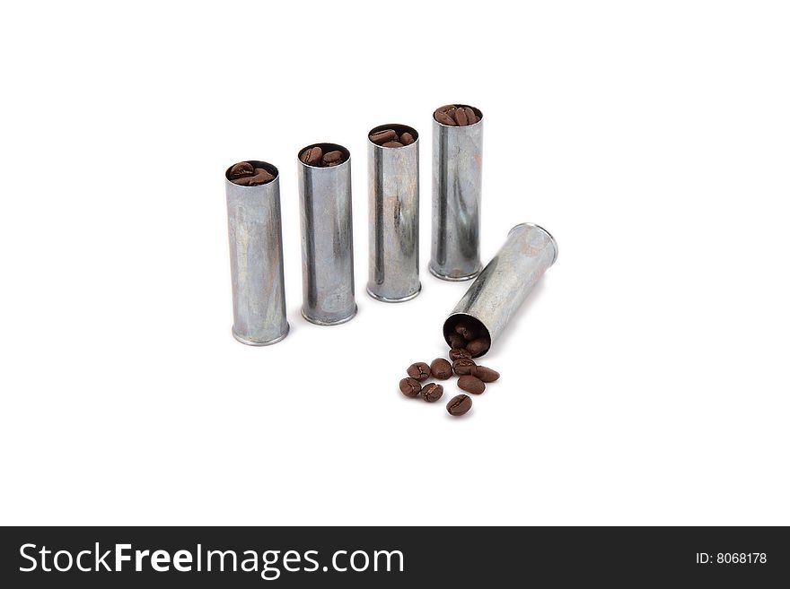 Silvery cartridges equipped by coffee grains on a white background
