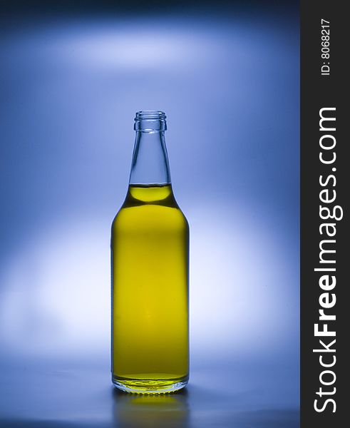 A transparent glass bottle is gap-filling a liquid. A transparent glass bottle is gap-filling a liquid