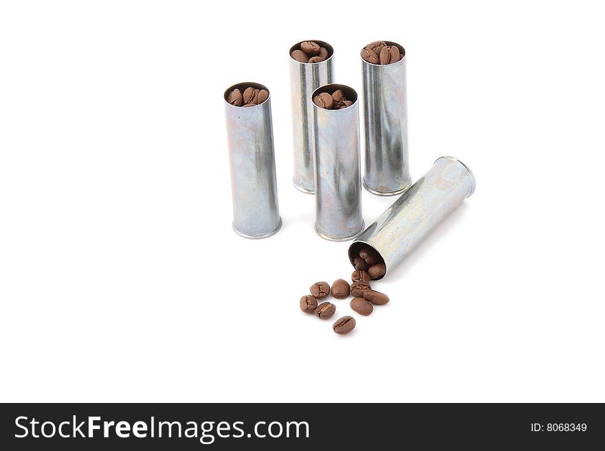 Silvery cartridges equipped by coffee grains on a white background