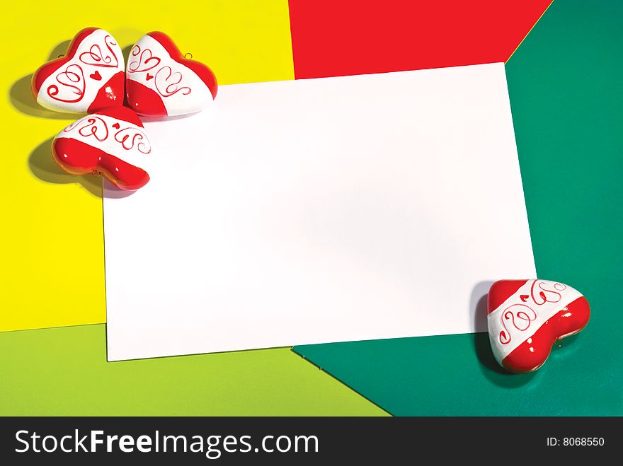 Greeting card with red hearts on color background