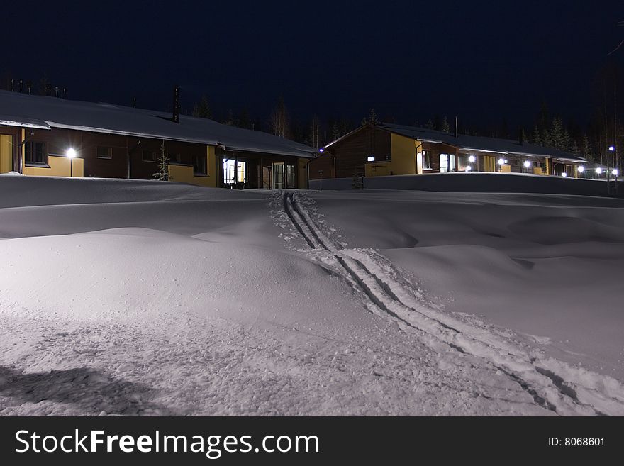 Winter cottages and traces from skiing.