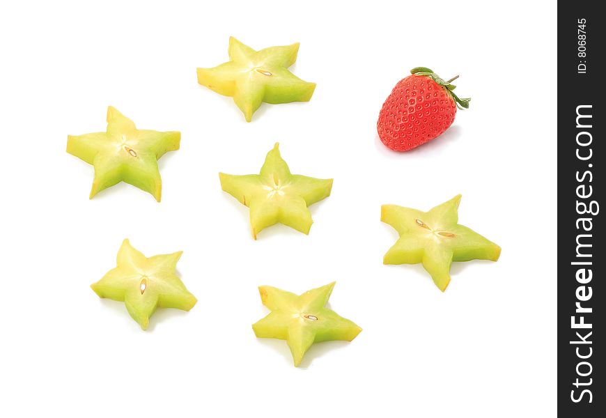 Strawberry near to tropical stars on a white background