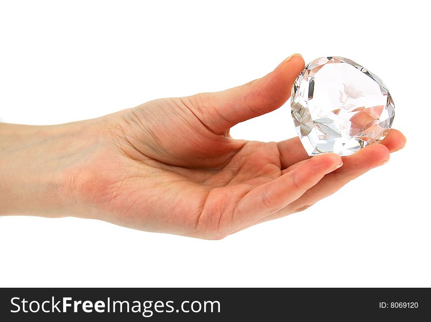 Women's hand holds crystal with declaration of love isolated