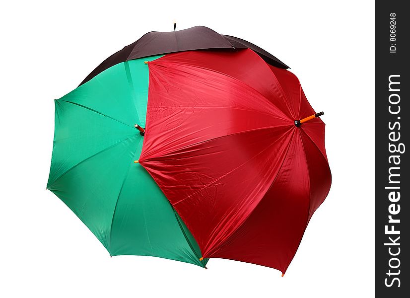 Red, green and black umbrellas isolated over white background