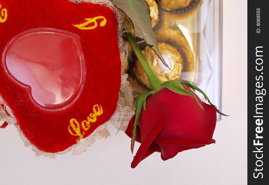 Red Rose flower on Chocolate Box with red Love pillow for Valentineâ€™s Day. Red Rose flower on Chocolate Box with red Love pillow for Valentineâ€™s Day